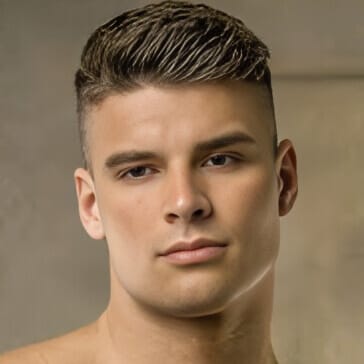 Malik Delgaty portrait showing clean masculine style