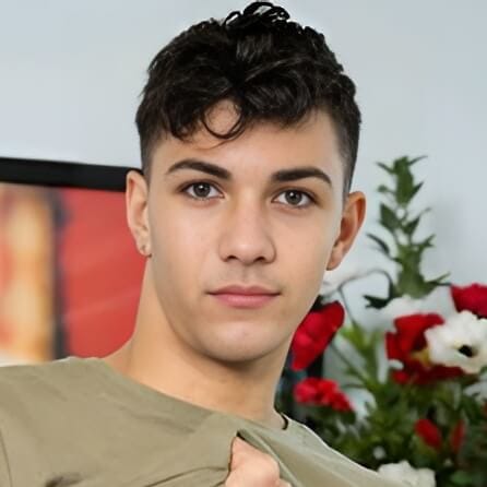 Alex Riley, gay adult performer with hazel eyes and dark brown hair